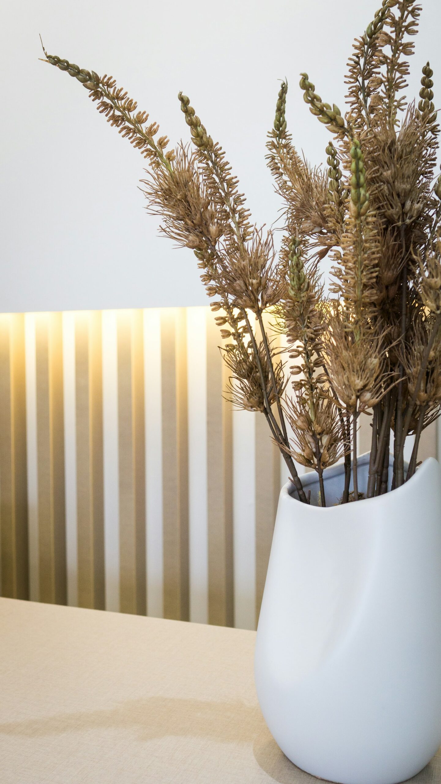 Dried grasses in white vase
