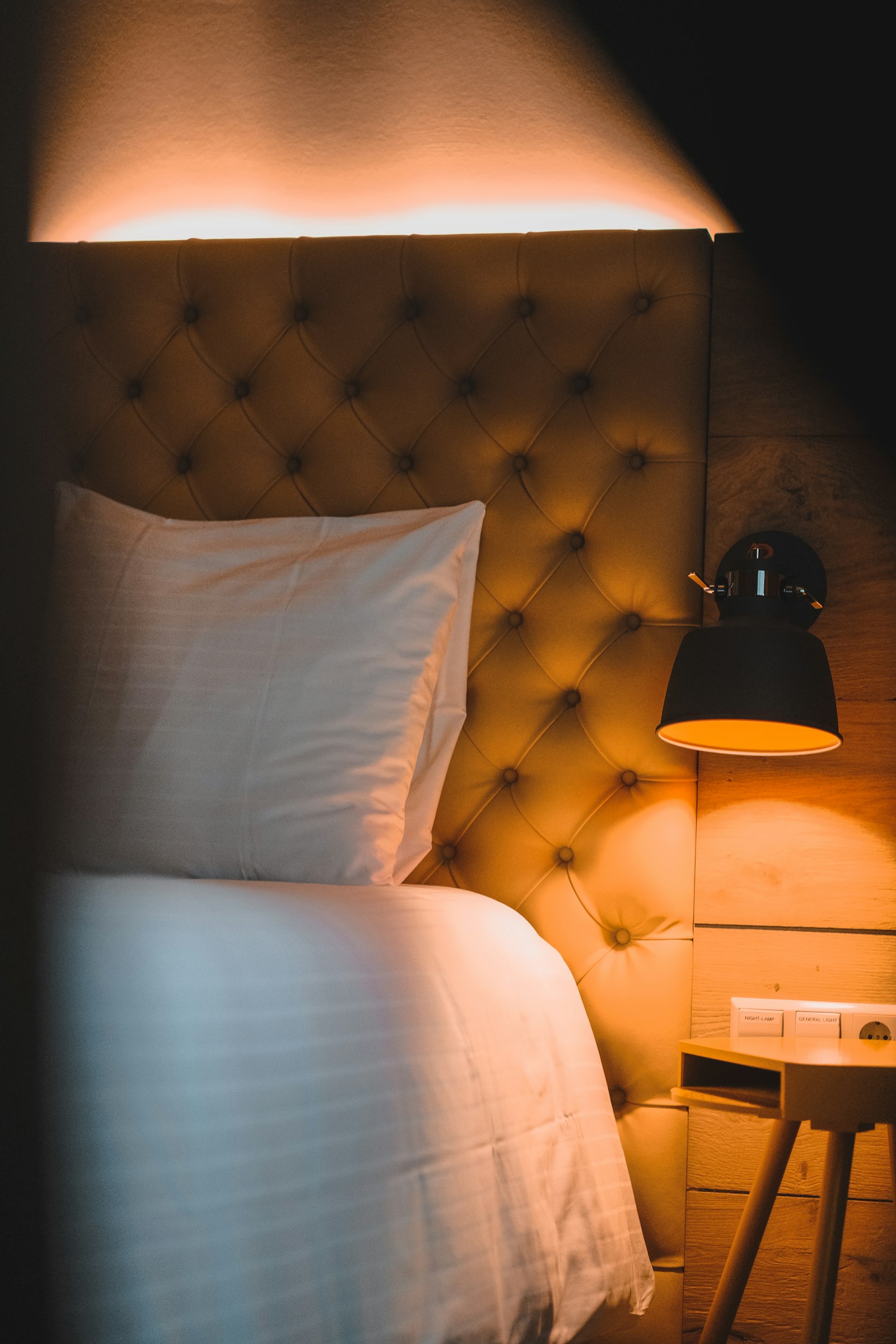 Bright hotel room with white linens