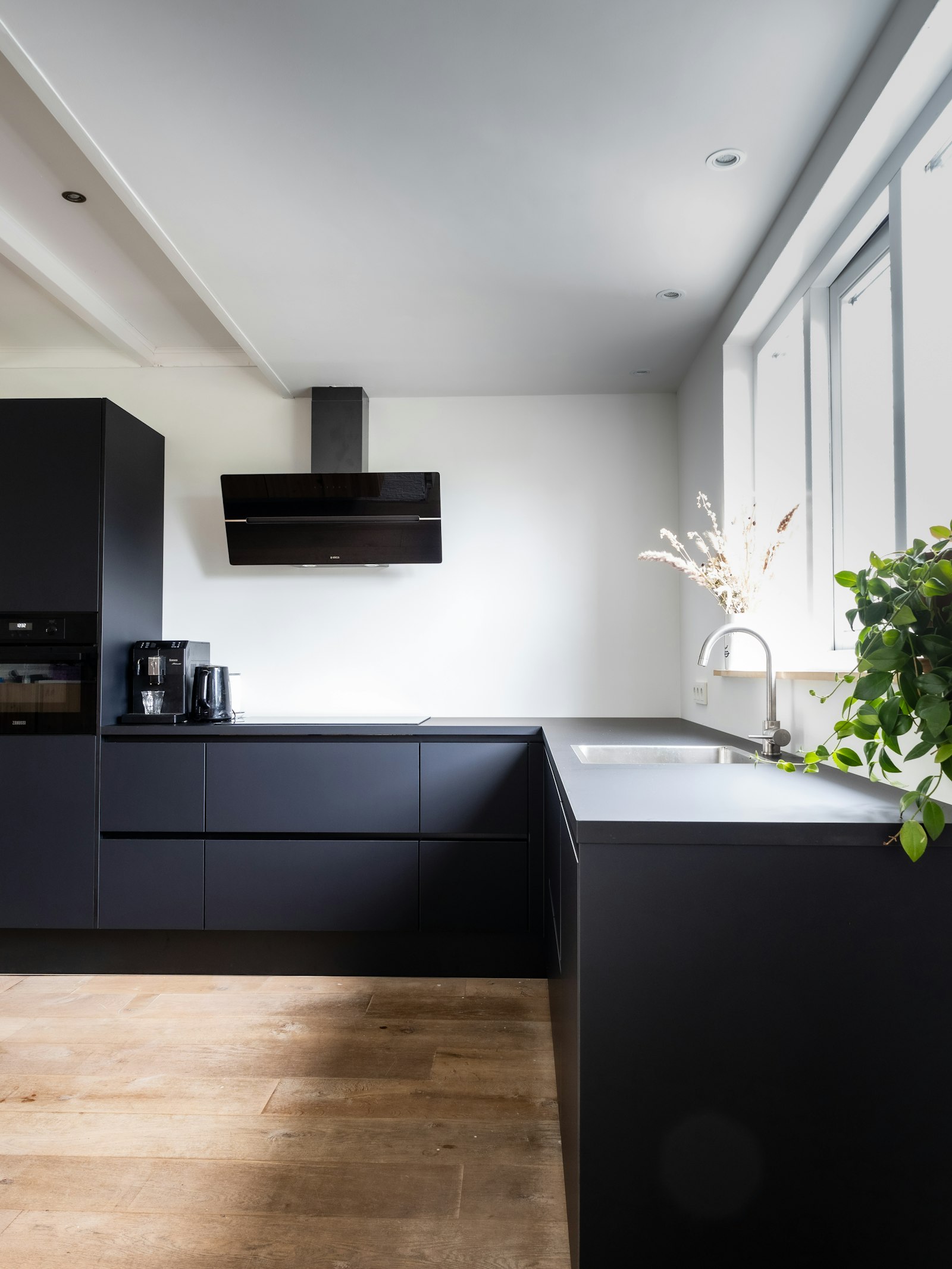 Black matte kitchen with brushed steel