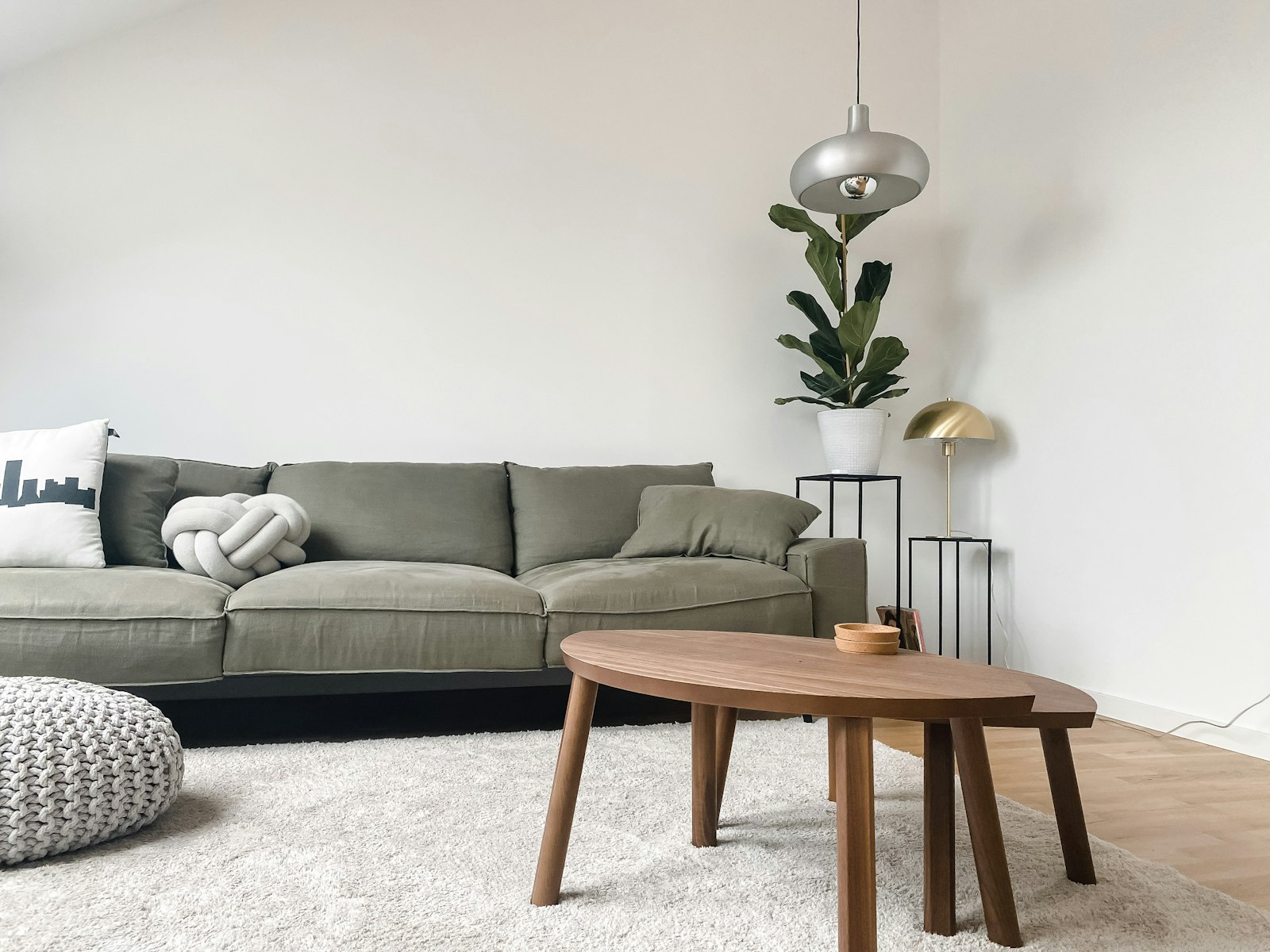 Gray linen sofa with fiddle leaf fig